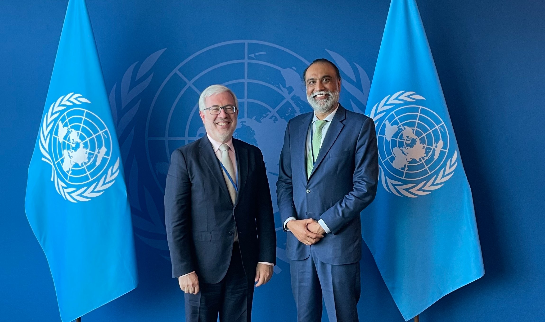 Two people smiling at DPGA conference with name badges